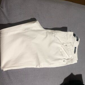 White pair of skinny ankle jeans